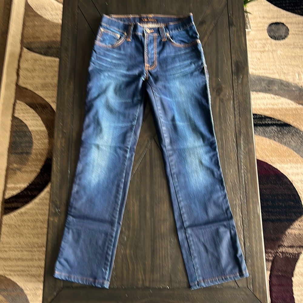 Distressed navy blue jeans, Nudie.